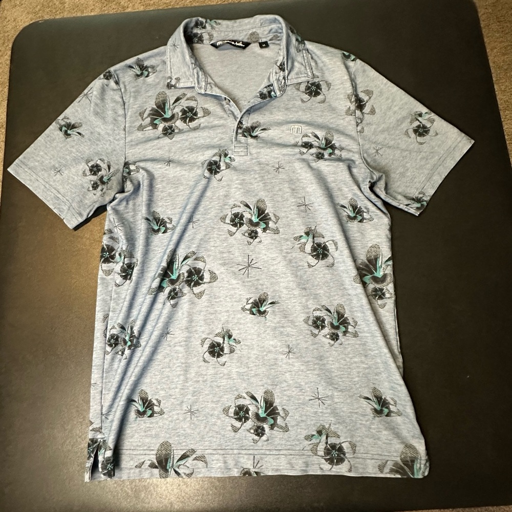 Travis Mathew Light Blue Polo Shirt with Floral Design